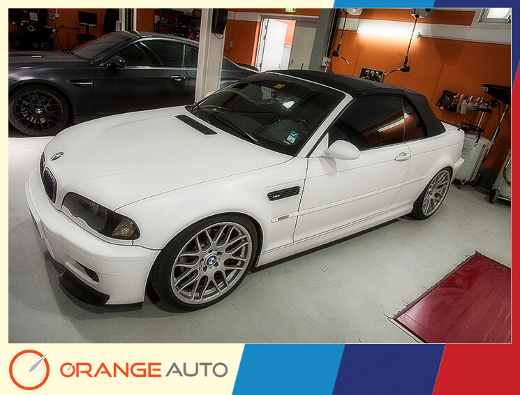 White BMW in a garage Dubai