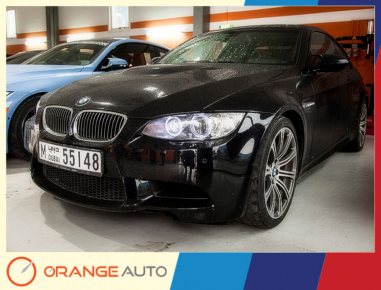 Black BMW in a garage