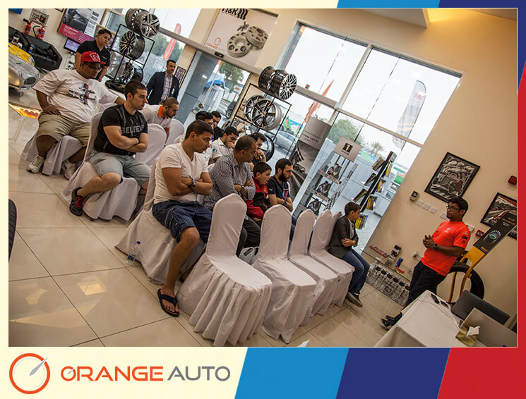 Presentation at Orange Auto center with cars in the background