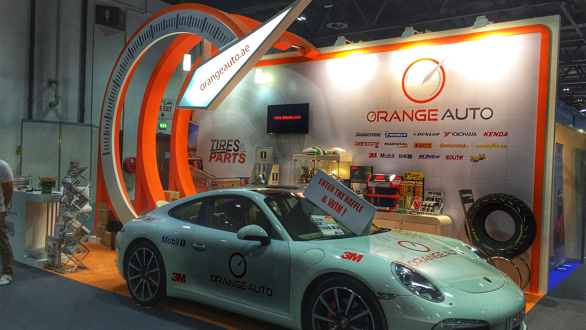 Orange Auto white Porsche at exhibition